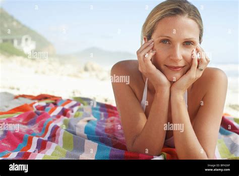 Woman Sunbathing On Beach Stock Photo Alamy