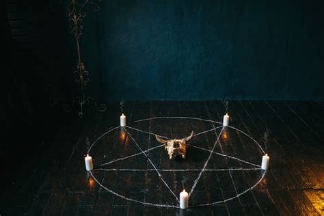 Premium Photo Pentagram Circle With Candles On Black Wooden Floor