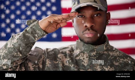 Rear View Of Military Man Saluting Us Flag Stock Photo Alamy