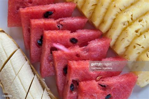 Slices Of Fresh Watermelon Banana And Pineapple High Res Stock Photo