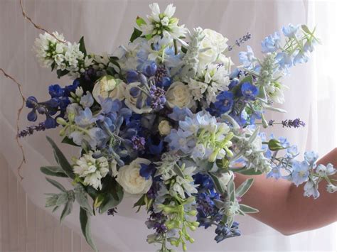 Gorgeous purple and silver wedding decorations and centerpieces. Blue, purple, silver wedding bouquet by Michaleen's # ...