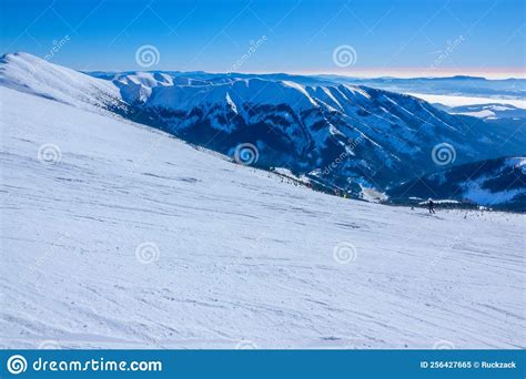 Sunny Winter Over Mountain Peaks And Wide Ski Slope Stock Image Image