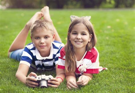 Pretty Little Brother And Sister Playing With A Camera In Summer Stock Image Image Of Little