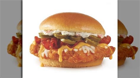 In addition to the choice of either grilled, classic, or spicy chicken breast, the sandwich is loaded with jalapeno cream cheese, shredded pepper jack cheese, jalapeno slices, applewood smoked bacon. Wendy's Is Shaking Up The Chicken Sandwich Wars With This ...