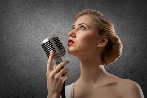 Attractive Female Singer With Microphone Stock Photo By ©khakimullin