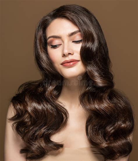 Wavy Hairstyle Model Brunette Woman With Shiny Smooth Hair Curls And