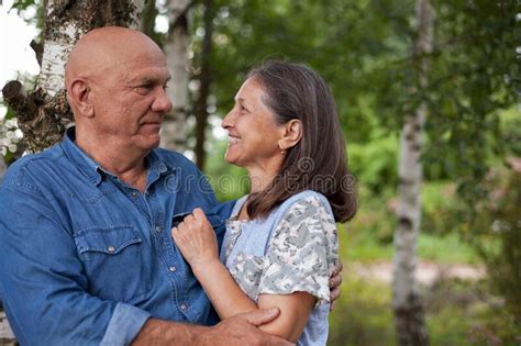 Older Man And Woman In Birch Grove Stock Image Image Of Hugging