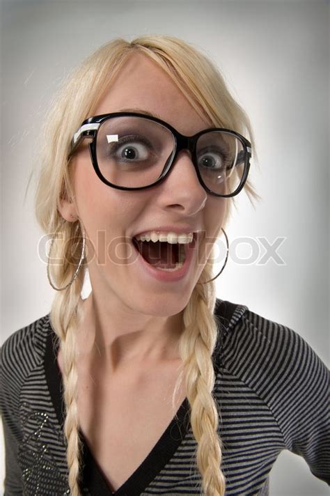 Happy And Smart Young Blond Woman With Funny Glasses And Plait Looks Like Nerdy Girl Smiling