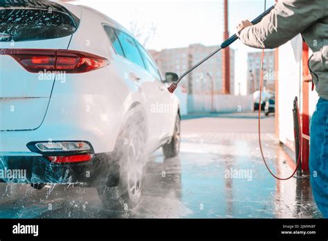 Manual Car Wash With Pressurized Water In Car Wash Outside Summer Car Washing Cleaning Car