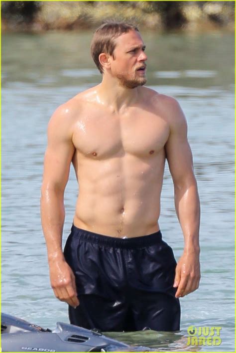 Shirtless Charlie Hunnam Puts On Sunscreen At The Beach In These Hot