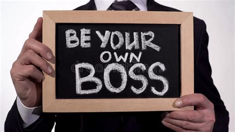 Be Your Own Boss Phrase On Blackboard In Businessman Hands Startup