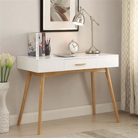 With a spacious desk top and three drawers that are perfect for keeping your space neat and clean of clutter while holding supplies right within reach, this desk is a stylish and functional addition to your home office space. Modern Mid-Century Style Writing Desk Console Table Drawer ...