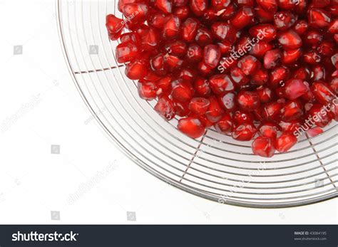 Wild pomegranate seeds are sometimes used as a spice, most notably in indian and pakistani the edible parts are the seeds and the red seed pulp surrounding them; Whole Bright Red Pomegranate Edible Seeds Imagen de archivo (stock) 43084195 : Shutterstock