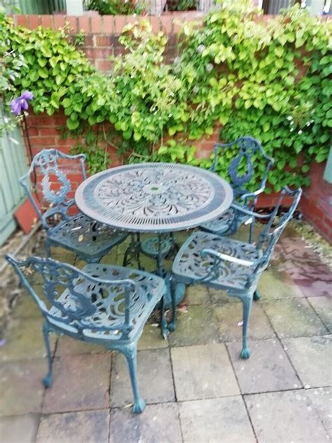 Patio Set Cast Iron Table And 4 Chairs Needs Refurbishing In