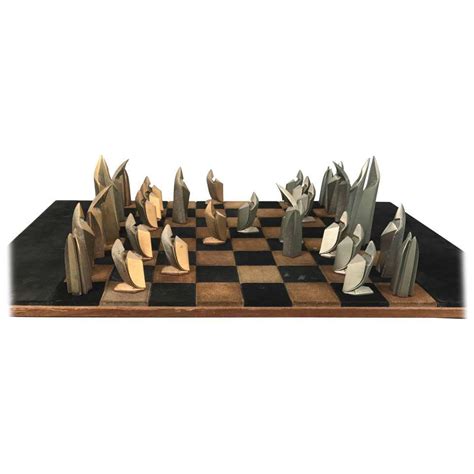 An elegant metal chess set with an inlaid wooden chess board that doubles up as a storage unit for the the set itself is a blend of antique features with a modern structure, which makes it different from other they currently boast a collection of over 50 different sets with unique dimensions and colors. Mid-Century Modern Bronze and Suede Chess Set, Cubist, Art ...