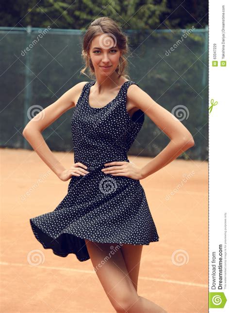 Beautiful Slim Tennis Girl With Dark Hair Wears Sports