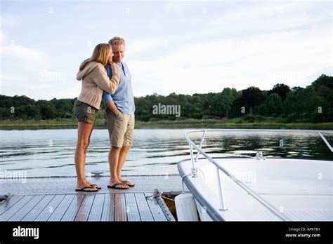 Couple Standing On Pier Stock Photo Alamy
