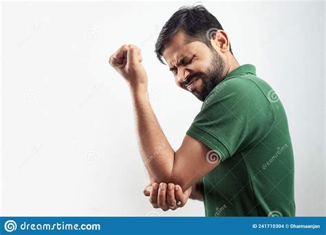 Single Person Showing Elbow Injury Pain Concept With Grimace Expression