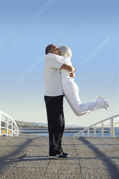 Man Lifting Woman Up Stock Image F0101000 Science Photo Library