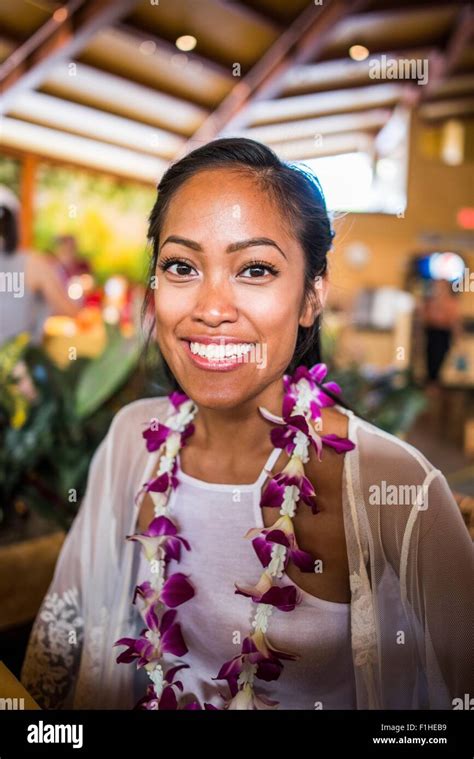Portrait Of Young Woman Wearing Flower Lei In Polynesian Cultural