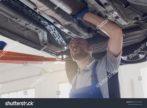 Professional Mechanic Working Under Car Repair Stock Photo 2014122437