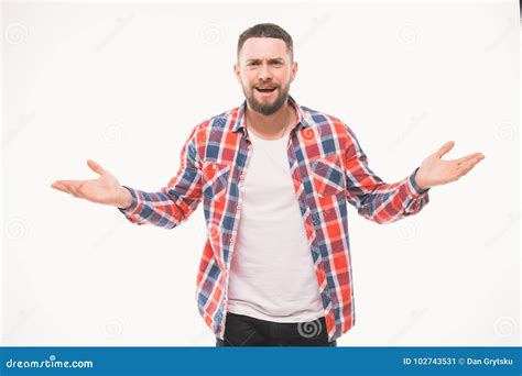 Portrait Of Handsome Young Man Asking Questions With Hands Raised On