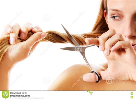 Young Blonde Woman Cutting Her Hair With Scissors Stock
