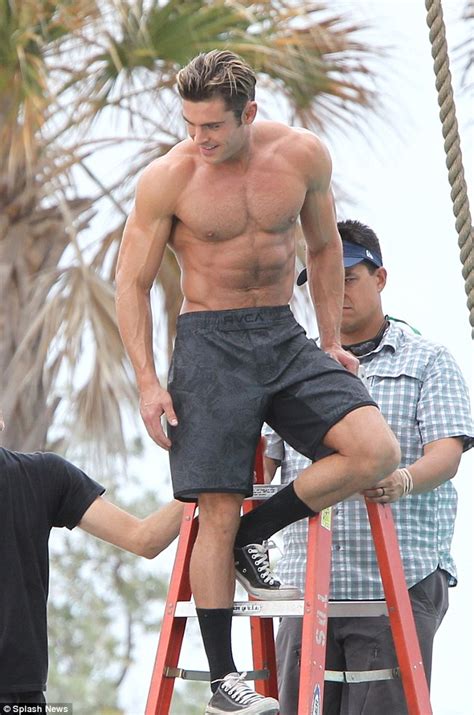 zac efron flexes his incredible muscles as he goes shirtless on baywatch set daily mail online