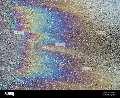 Multi Colored Oil Spill On Asphalt Road Abstract Background Stock