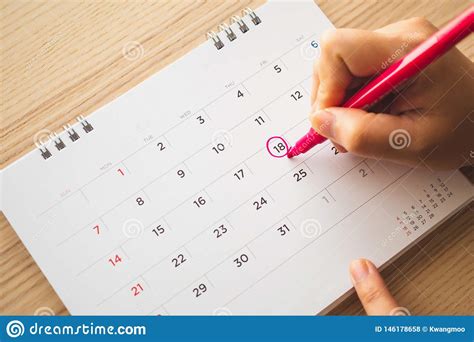 Hand With Pen Mark On Calendar Date Stock Photo Image Of Date