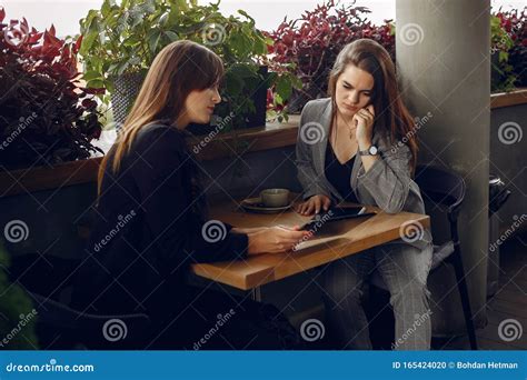Two Businesswomen Working In A Cafe Stock Photo Image Of