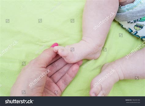 Babys Legs Mothers Hand Stock Photo 780295180 Shutterstock
