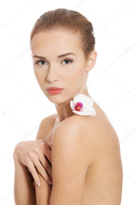 Nude Naked Woman Having White Flower On Shoulders Stock Photo By Piotr Marcinski