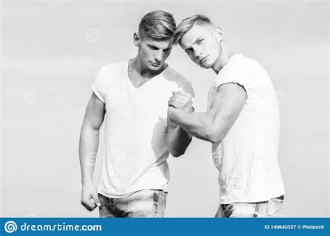 Men Twins Brothers Muscular Guys In White Shirts Sky