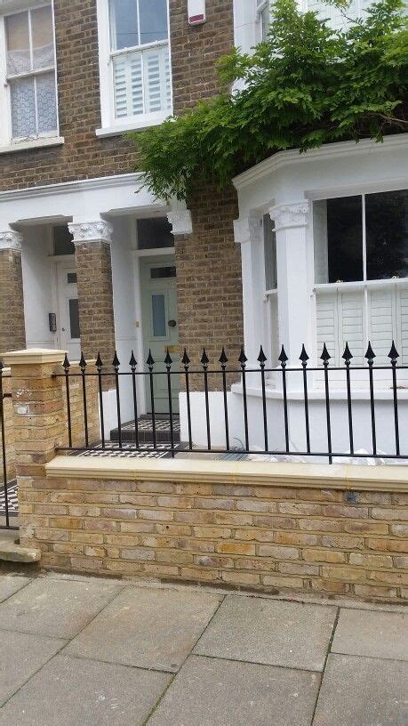 Classic london front garden wall tiles metal rails perfect balance of elegance tradition and style. Front garden - brick wall, decorative railing, tiled path and shutter windows | Victorian front ...