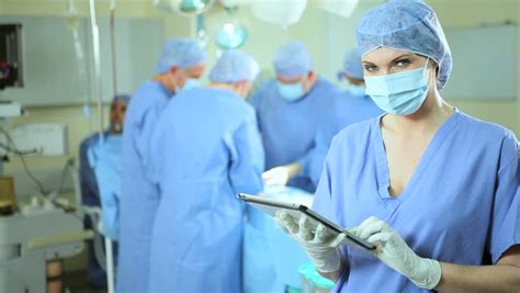 Portrait 6 Member Surgical Team Wearing Full Hospital Scrubs In