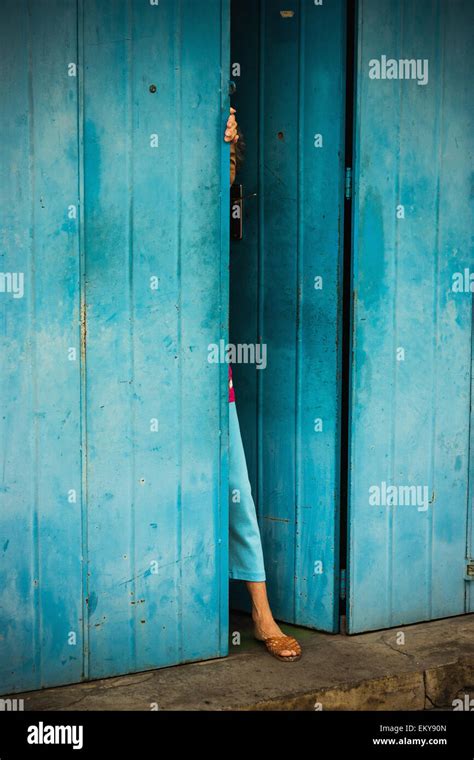 Woman Peeking Out Of Doorway Malacca Malaysia Stock Photo Alamy