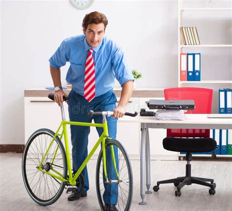 Young Businessman Using Bike To Commute To The Office Stock Photo