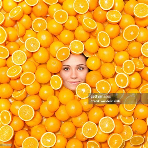 Womans Face Surrounded With Oranges High Res Stock Photo Getty Images