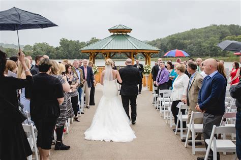 Kristen Vota Photography Bride And Her Father Walk Down The Aisle At A Rainy Outdoor Ceremony
