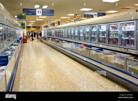 Shoppers And Interior View Tesco Supermarket Frozen Food Aisle And Cold