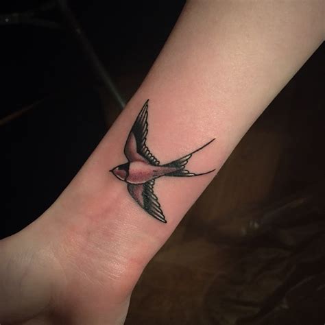 swallow tattoo on a wrist by javier betancourt