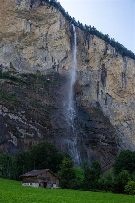 Staubbach Waterfall In Lauterbrunnen Switzerland Above Farmhouse Stock