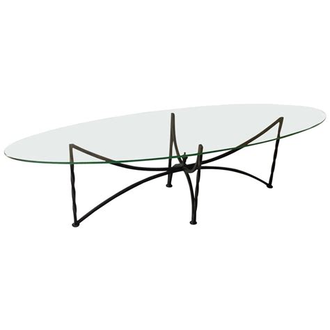 On sale for $265.99 original price $279.99 $ 265.99 $279.99. Oval Glass Top Coffee Table with Wrought Iron Base at 1stdibs