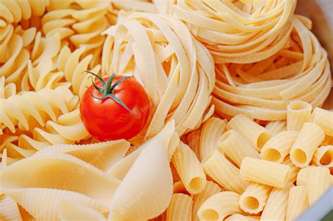 Premium Photo Different Types Of Italian Pasta On A Wooden Background