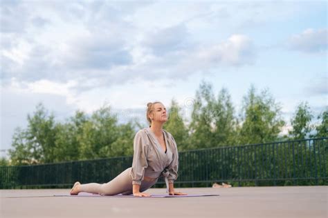 Flexible Young Woman With Sporty Body Doing Yoga Exercise Upward Wheel