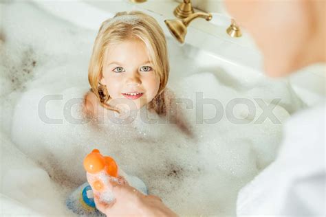 Mother Washing Daughter In Bathtub Stock Image Colourbox