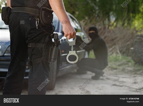 Police Officer Holding Image And Photo Free Trial Bigstock