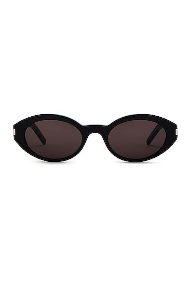 saint laurent oval sunglasses in black fwrd