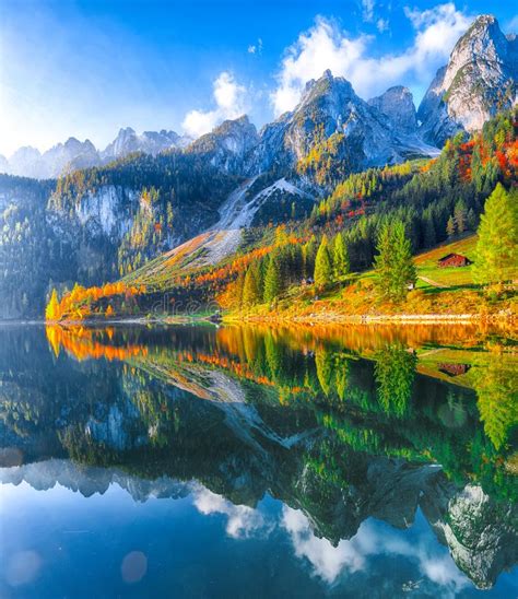 Autumn Scenery With Dachstein Mountain Summit Reflecting In Crystal